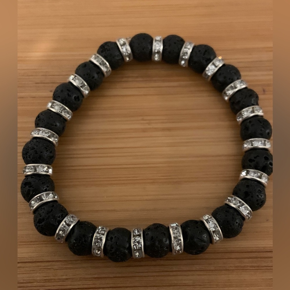 Black lava bead stretch bracelet with rhinestone accents. NWOT